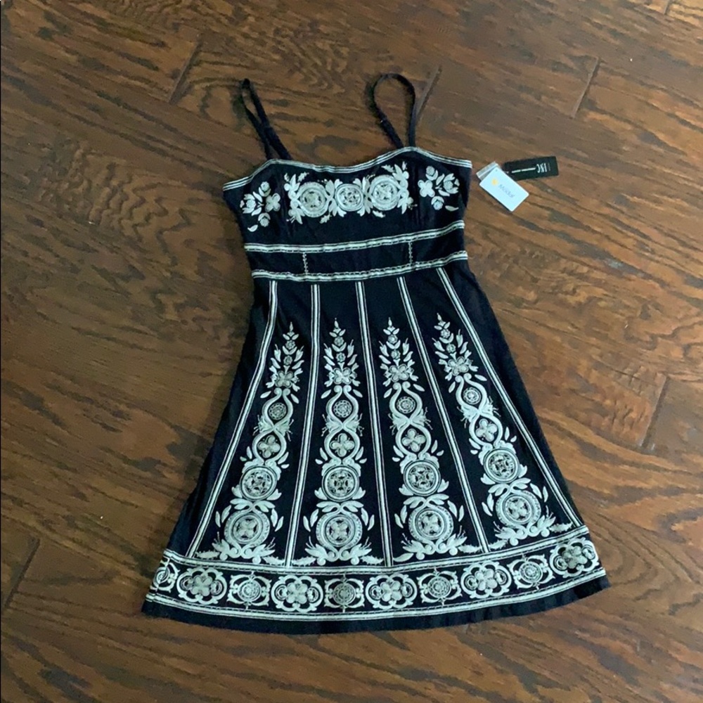 Black knit dress with embroidery and beading